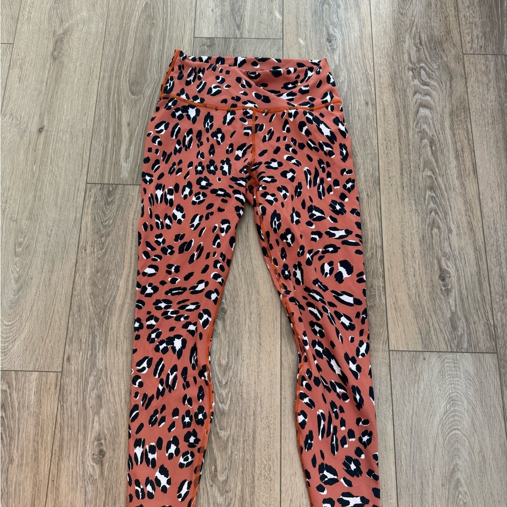 Fabletics Orange and Black PowerHold Leggings